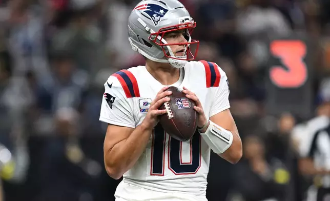 New England Patriots quarterback Drake Maye looks to throw during the second half of an NFL football game against the New Orleans Saints, Sunday, Oct. 12, 2025, in New Orleans. (AP Photo/Ella Hall)