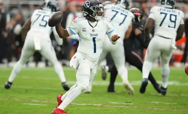 Tennessee Titans quarterback Cam Ward (1) looks to throw a pass during the second half of an NFL football game against the Arizona Cardinals, Sunday, Oct. 5, 2025, in Glendale, Ariz. (AP Photo/Rick Scuteri)