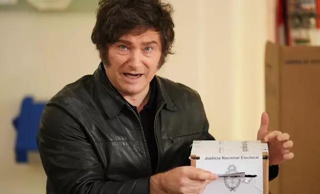 Argentina's President Javier Milei votes during legislative midterm elections in Buenos Aires, Argentina, Sunday, Oct. 26, 2025. (AP Photo/Natacha Pisarenko)