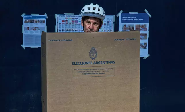 Fabian Gropper casts his vote during legislative midterm elections in Buenos Aires, Argentina, Sunday, Oct. 26, 2025. (AP Photo/Rodrigo Abd)