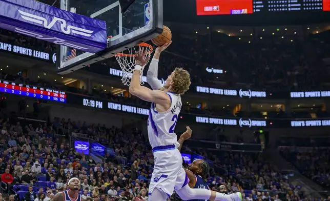 Utah Jazz forward Lauri Markkanen (23) lays the ball into the basket during the first half of an NBA basketball game against the Los Angeles Clippers, Wednesday, Oct. 22, 2025, in Salt Lake City. (AP Photo/Tyler Tate)