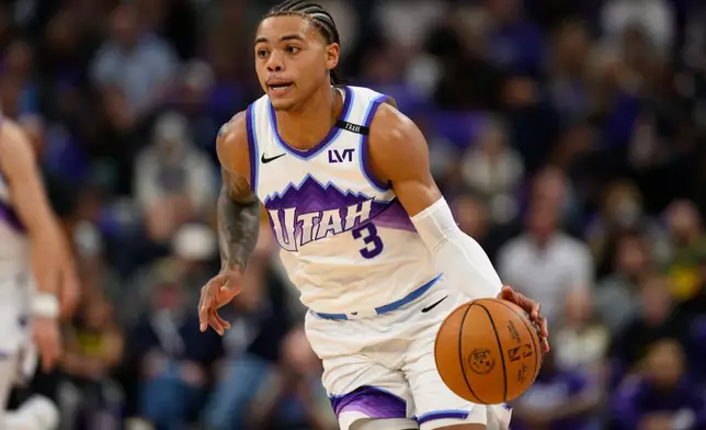 Utah Jazz guard Keyonte George (3) dribbles the basketball during the first half of an NBA basketball game against the LA Clippers, Wednesday, Oct. 22, 2025, in Salt Lake City. (AP Photo/Tyler Tate)