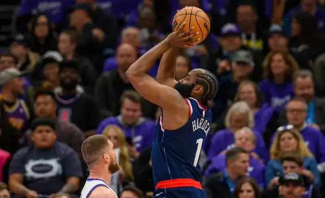 LA Clippers guard James Harden (1) takes the shot over Utah Jazz guard Svi Mykhailiuk (10) during the first half of an NBA basketball game, Wednesday, Oct. 22, 2025, in Salt Lake City. (AP Photo/Tyler Tate)
