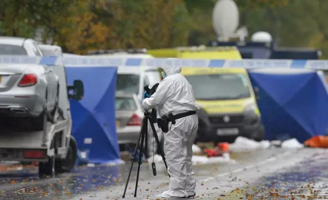 A forensic officer works at the scene of a stabbing incident at Heaton Park Hebrew Congregation synagogue, in Crumpsall, Manchester, England, Friday, Oct. 3, 2025,the attack took place Thursday. (AP Photo/Ian Hodgson)