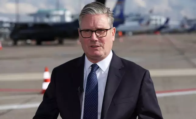 British Prime Minister Keir Starmer makes a statement about a stabbing incident in Manchester, England, after he left the European Political Community summit, at Copenhagen Airport, in Kastrup, Denmark, Thursday, Oct. 2, 2025. (Suzanne Plunkett/Pool Photo via AP)
