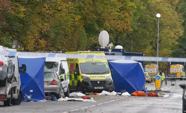 Police guard the scene of a stabbing incident at Heaton Park Hebrew Congregation synagogue, in Crumpsall, Manchester, England, Friday, Oct. 3, 2025, following Thursday's attack. (AP Photo/Ian Hodgson)