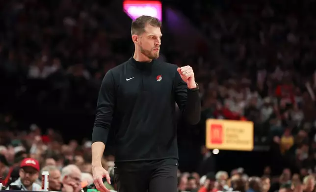 Portland Trail Blazers acting head coach Tiago Splitter reacts during the second half of an NBA basketball game against the Golden State Warriors Friday, Oct. 24, 2025, in Portland, Ore. (AP Photo/Amanda Loman)