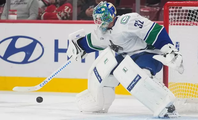 Vancouver Canucks goaltender Kevin Lankinen makes a save against the Chicago Blackhawks during the second period of an NHL hockey game Friday, Oct. 17, 2025, in Chicago. (AP Photo/Erin Hooley)