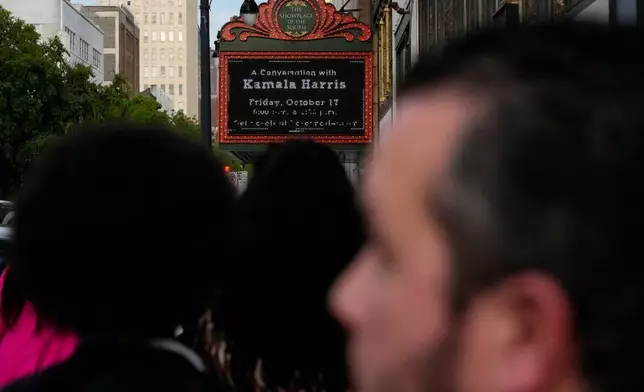 People wait in line to hear Former Vice President Kamala Harris speak about her new book, "107 Days," at an event Friday, Oct. 17, 2025, in Birmingham, Ala. (AP Photo/Mike Stewart)