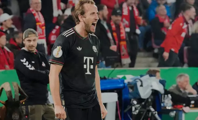 Bayern's Harry Kane celebrates after scoring his side's second goal during the German soccer cup match between Cologne and FC Bayern Munich in Cologne, Wednesday, Oct. 29, 2025. (AP Photo/Martin Meissner)