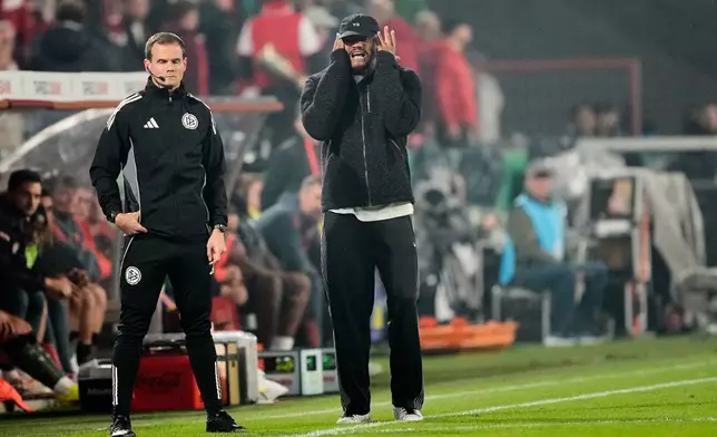 Bayern's head coach Vincent Kompany reacts during the German soccer cup match between Cologne and FC Bayern Munich in Cologne, Wednesday, Oct. 29, 2025. (AP Photo/Martin Meissner)