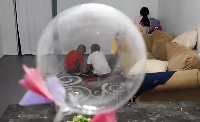 Mexican asylum-seeker Blanca's three young children play inside the family's rented duplex in Apopka, Fla., Wednesday, Aug. 20, 2025. (AP Photo/Rebecca Blackwell)