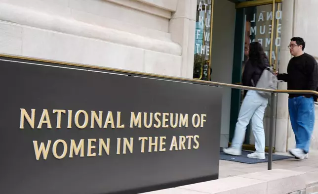 People are seen entering the main entrance to the National Museum of Women in the Arts in downtown Washington, Wednesday, Oct. 29, 2025. (AP Photo/Pablo Martinez Monsivais)