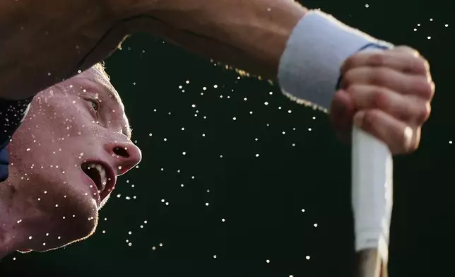 Jiri Lehecka, of the Czech Republic serves against Denis Shapovalov, of Canada during the men's singles match of the Shanghai Masters tennis tournament at Qizhong Forest Sports City Tennis Center, in Shanghai, China, Monday, Oct. 6, 2025. (AP Photo/Andy Wong)