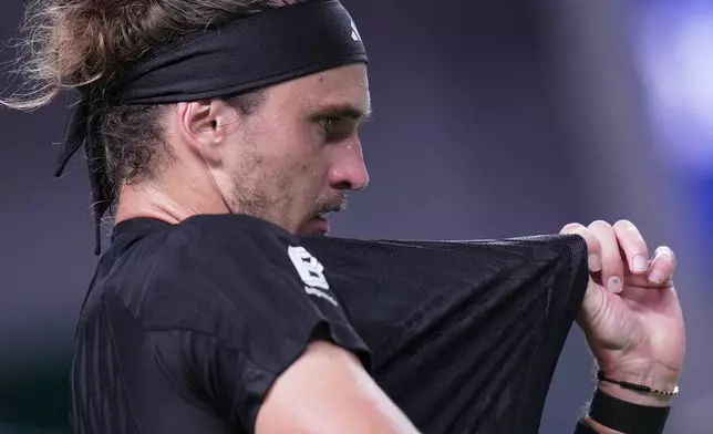 Alexander Zverev of Germany reacts during the men's singles match against Arthur Rinderknech of France, in the Shanghai Masters tennis tournament at Qizhong Forest Sports City Tennis Center, in Shanghai, China, Monday, October. 6, 2025. (AP Photo/Andy Wong)
