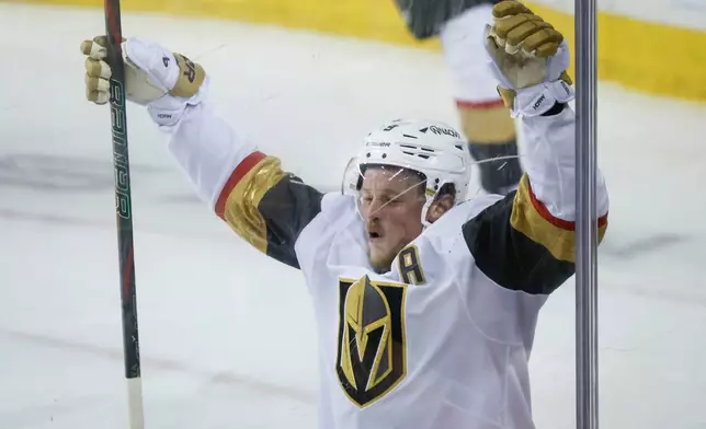Vegas Golden Knights' Jack Eichel celebrates his goal during the third period of an NHL hockey game against the Calgary Flames in Calgary, Alberta, on Tuesday, Oct. 14, 2025. (Jeff McIntosh/The Canadian Press via AP)