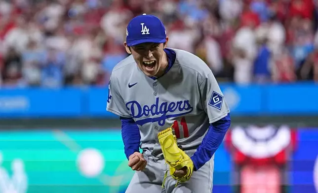 Los Angeles Dodgers pitcher Roki Sasaki reacts after the Dodgers defeated the Philadelphia Phillies in Game 1 of baseball's National League Division Series, Saturday, Oct. 4, 2025, in Philadelphia. (AP Photo/Matt Rourke)