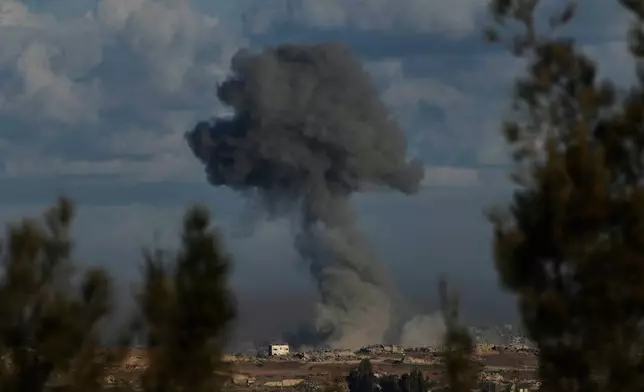 Smoke rises following an Israeli army bombardment in the Gaza Strip, as seen from Kibbutz Kfar Aza, southern Israel, Tuesday, Oct. 7, 2025. (AP Photo/Ohad Zwigenberg)