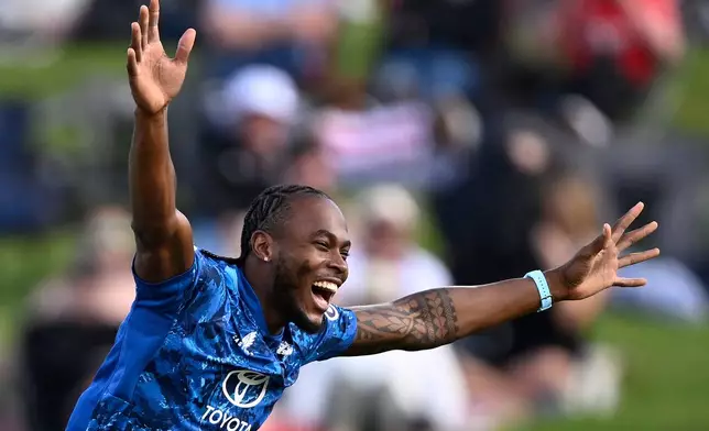 England's bowler Jofra Archer celebrates the wicket of New Zealand's Will Young during their T20 cricket match in Hamilton, New Zealand, Wednesday, Oct. 29, 2025. (Andrew Cornaga/Photosport via AP)