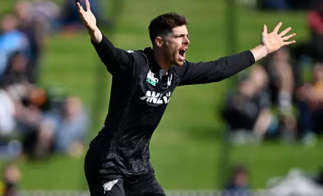 New Zealand's Mitchell Santner unsuccessfully appeal for a decision against England during their T20 cricket match in Hamilton, New Zealand, Wednesday, Oct. 29, 2025. (Andrew Cornaga/Photosport via AP)