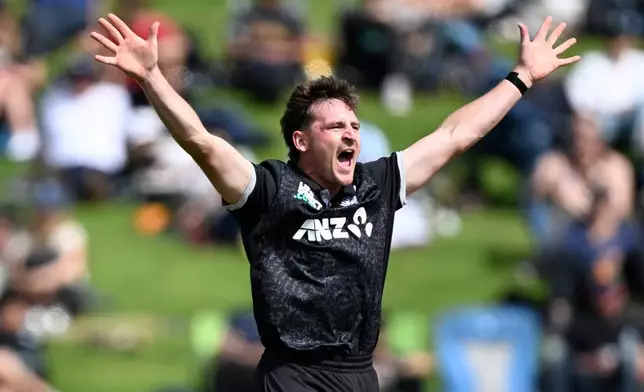New Zealand's bowler Nathan Smith successfully appeals for a LBW decision to dismiss England's Jos Butler during their T20 cricket match in Hamilton, New Zealand, Wednesday, Oct. 29, 2025. (Andrew Cornaga/Photosport via AP)