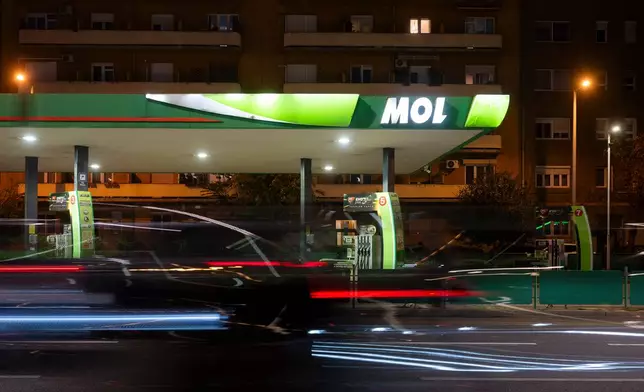 A car drives by a of MOL gas station in downtown Budapest, Hungary, on Sept. 27, 2025. (AP Photo/Denes Erdos)