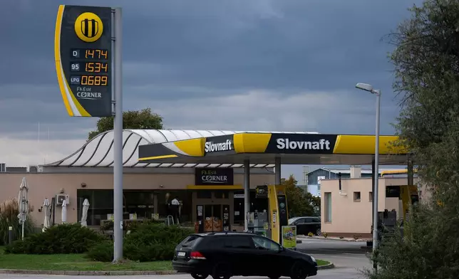 A car enters a Slovak gas station called Slovnaft, which is owned by MOL, Hungary's national oil and gas conglomerate, near Sturovo, Slovakia, on Sept. 28, 2025. (AP Photo/Denes Erdos)