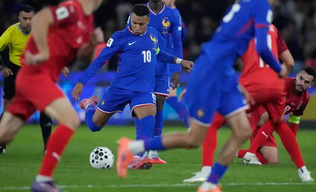 France's Kylian Mbappe shoots during a World Cup 2026 Group D qualifying soccer match between France and Azerbaijan in Paris, France, on Friday, Oct. 10, 2025. (AP Photo/Michel Euler)