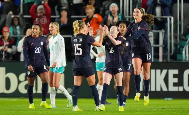 United States midfielder Rose Lavelle (16) celebrates with teammates after scoring a goal during the first half of a women's international friendly soccer match against New Zealand, Wednesday, Oct. 29, 2025, in Kansas City, Mo. (AP Photo/Charlie Riedel)