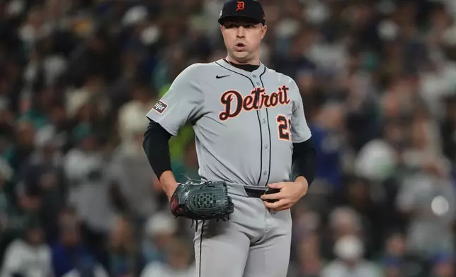 Detroit Tigers starting pitcher Tarik Skubal reacts after giving up a single to Seattle Mariners designated hitter Mitch Garver during the seventh inning in Game 2 of baseball's American League Division Series, Sunday, Oct. 5, 2025, in Seattle. (AP Photo/Lindsey Wasson)