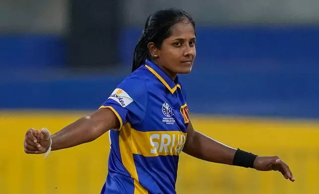 Sri Lanka's Inoka Ranaweera celebrates the wicket of England's Emma Lamb during the ICC Women's Cricket World Cup match between England and Sri Lanka at Premadasa Stadium in Colombo, Sri Lanka, Saturday, Oct. 11, 2025. (AP Photo/Eranga Jayawardena)