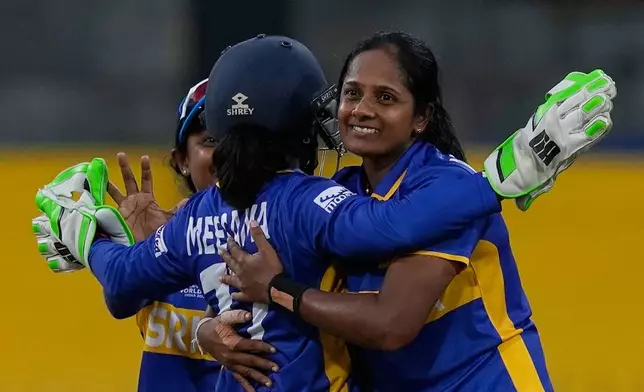 Sri Lanka's Inoka Ranaweera celebrates the wicket of England's Alice Capsey with teammates during the ICC Women's Cricket World Cup match between England and Sri Lanka at Premadasa Stadium in Colombo, Sri Lanka, Saturday, Oct. 11, 2025. (AP Photo/Eranga Jayawardena)