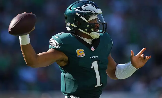Philadelphia Eagles quarterback Jalen Hurts looks to pass during the second half of an NFL football game against the Denver Broncos on Sunday, Oct. 5, 2025, in Philadelphia. (AP Photo/Matt Rourke)