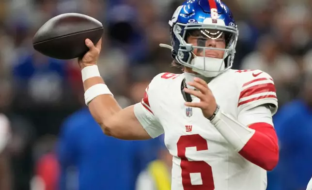 New York Giants quarterback Jaxson Dart (6) works in the pocket against the New Orleans Saints in the first half of an NFL football game, Sunday, Oct. 5, 2025, in New Orleans. (AP Photo/Gerald Herbert)