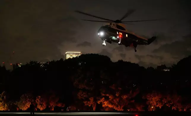 Marine One with President Donald Trump aboard prepares to land at Hardy Barracks, also known as Akasaka Press Center, in Tokyo, Japan, Monday, Oct. 27, 2025. (AP Photo/Mark Schiefelbein)