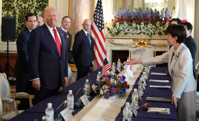 President Donald Trump, front left, and Japan's Prime Minister Sanae Takaichi, right, arrive for their bilateral meeting at Akasaka Palace in Tokyo, Japan, Tuesday, Oct. 28, 2025. (AP Photo/Mark Schiefelbein)