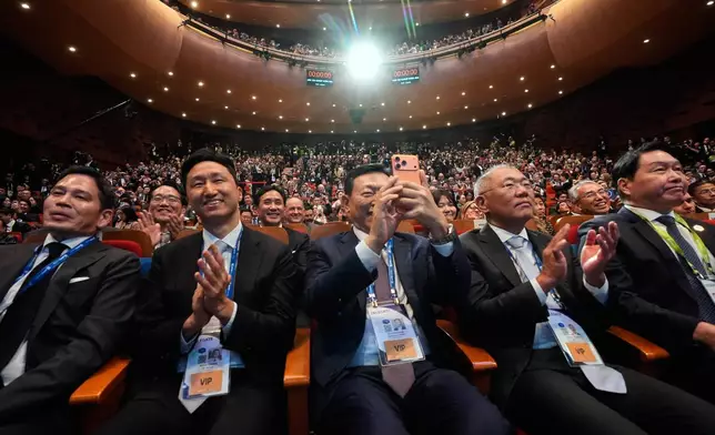 Guests applaud as President Donald Trump speaks at an Asia-Pacific Economic Cooperation (APEC) CEO luncheon in Gyoeongju, South Korea, Wednesday, Oct. 29, 2025. (AP Photo/Mark Schiefelbein)