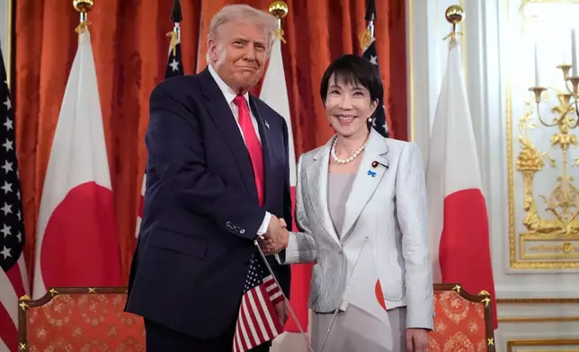 President Donald Trump, left, and Japan's Prime Minister Sanae Takaichi shake hands during a signing ceremony at Akasaka Palace in Tokyo, Japan, Tuesday, Oct. 28, 2025. (AP Photo/Mark Schiefelbein)