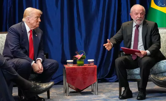 President Donald Trump meets with Brazil's President Luiz Inacio Lula da Silva on the sidelines of the ASEAN Summit in Kuala Lumpur, Malaysia, Sunday, Oct. 26, 2025. (AP Photo/Mark Schiefelbein)