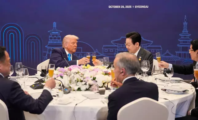 President Donald Trump toasts with state leaders including South Korean President Lee Jae Myung, center right, during a dinner event in Gyeongju, South Korea, Wednesday, Oct. 29, 2025. (AP Photo/Mark Schiefelbein)