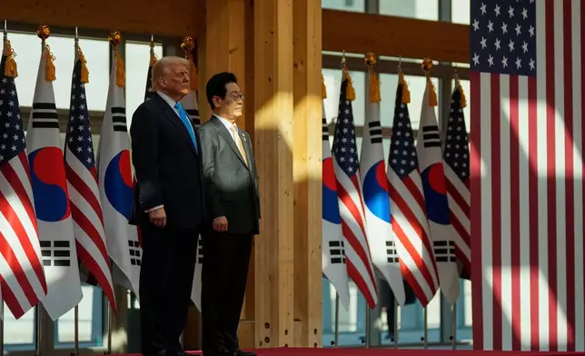 President Donald Trump, left, and South Korean President Lee Jae Myung attend a high honor ceremony at the Gyeongju National Museum in Gyoeongju, South Korea, Wednesday, Oct. 29, 2025. (AP Photo/Mark Schiefelbein)