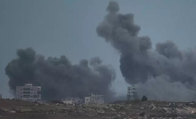Smoke rises to the sky following an Israeli military strike in the northern Gaza Strip, as seen from southern Israel, Monday, Oct. 6, 2025. (AP Photo/Leo Correa)