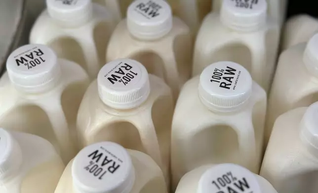 FILE - Bottles of raw milk are displayed for sale at a store in Temecula, Calif., on Wednesday, May 8, 2024. (AP Photo/JoNel Aleccia, File)