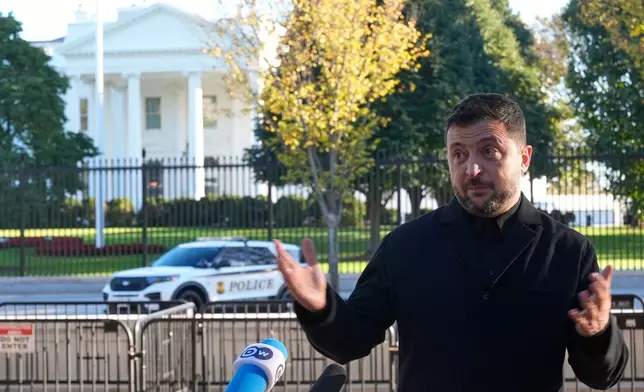 Ukraine's President Volodymyr Zelenskyy speaks to reporters in Lafayette Park across the street from the White House, following a meeting with President Donald Trump, Friday, Oct. 17, 2025, in Washington. (AP Photo/Manuel Balce Ceneta)