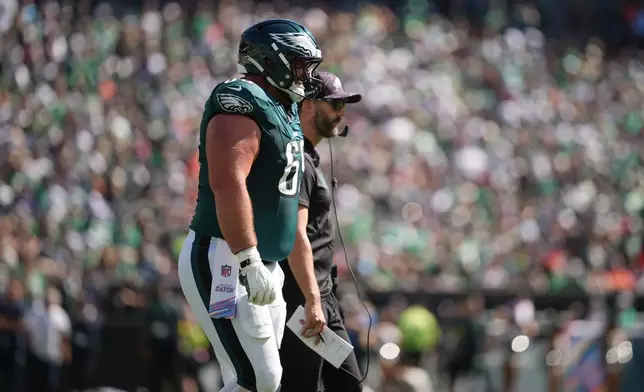 Philadelphia Eagles guard Landon Dickerson (69) walks off the field after an injury during the first half of an NFL football game against the Denver Broncos on Sunday, Oct. 5, 2025, in Philadelphia. (AP Photo/Matt Slocum)