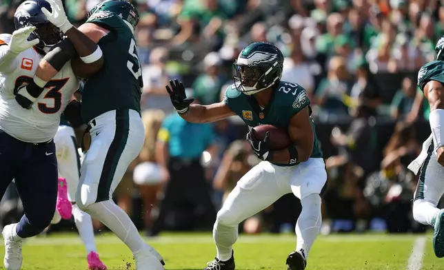 Philadelphia Eagles running back Saquon Barkley (26) carries the ball during the first half of an NFL football game against the Denver Broncos on Sunday, Oct. 5, 2025, in Philadelphia. (AP Photo/Matt Rourke)