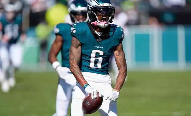 Philadelphia Eagles wide receiver Devonta Smith (6) reacts to a catch for a first down during the first half of an NFL football game against the Denver Broncos on Sunday, Oct. 5, 2025, in Philadelphia. (AP Photo/Chris Szagola)