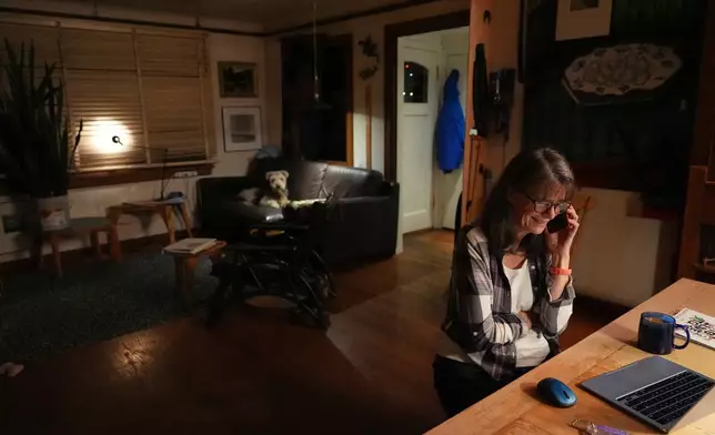 Mary E. Brunkow speaks on the phone with the Nobel committee about winning a Nobel Prize in medicine for part of her work on peripheral immune tolerance, in Seattle, Monday, Oct. 6, 2025. (AP Photo/Lindsey Wasson)