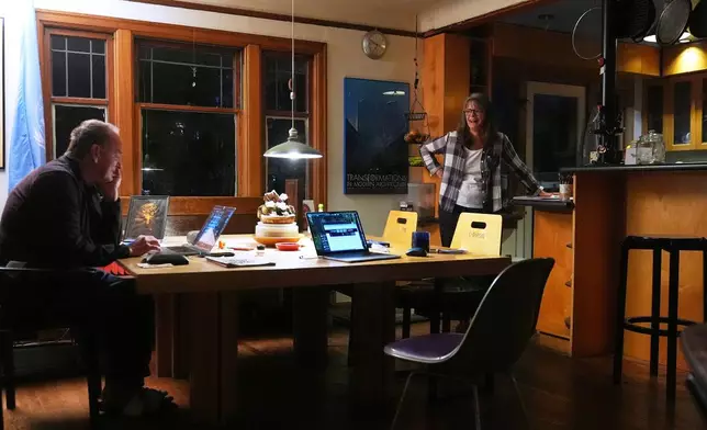 Mary E. Brunkow and her husband Ross Colquhoun talk with one of their daughters on the phone about her winning a Nobel Prize in medicine for part of her work on peripheral immune tolerance, in Seattle, Monday, Oct. 6, 2025. (AP Photo/Lindsey Wasson)