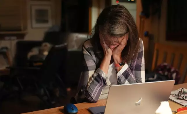 Mary E. Brunkow becomes emotional after hearing about winning a Nobel Prize in medicine for part of her work on peripheral immune tolerance, in Seattle, Monday, Oct. 6, 2025. (AP Photo/Lindsey Wasson)